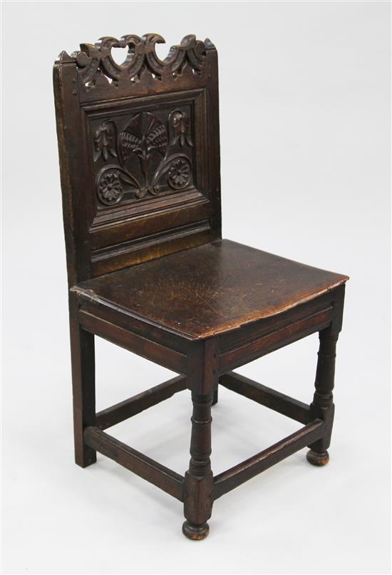 A carved oak back stool, c.1700,